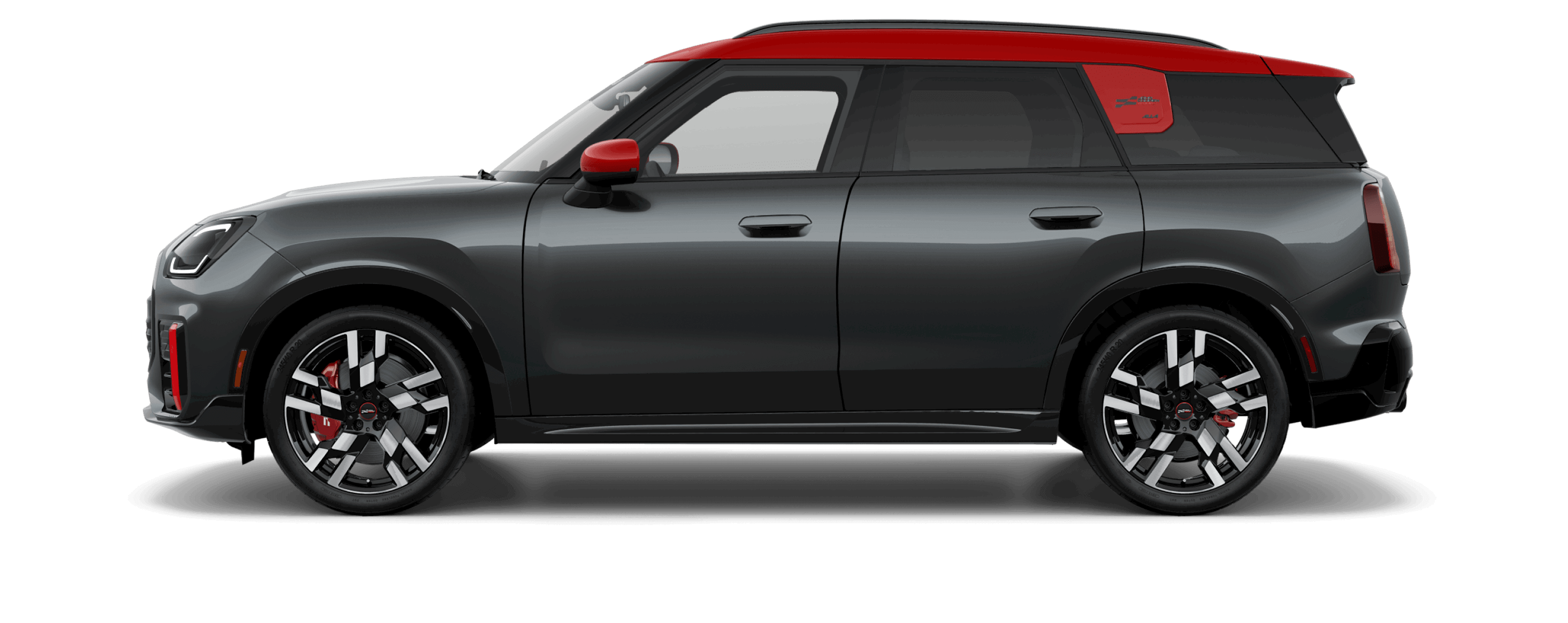 Side view of a MINI JCW Countryman ALL4 in the Legend Grey body color, facing left with its shadow underneath it.