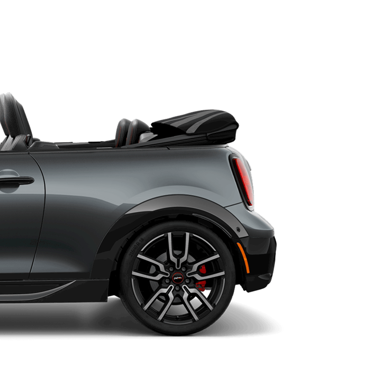Side view of the rear of a JCW Convertible with the top down.