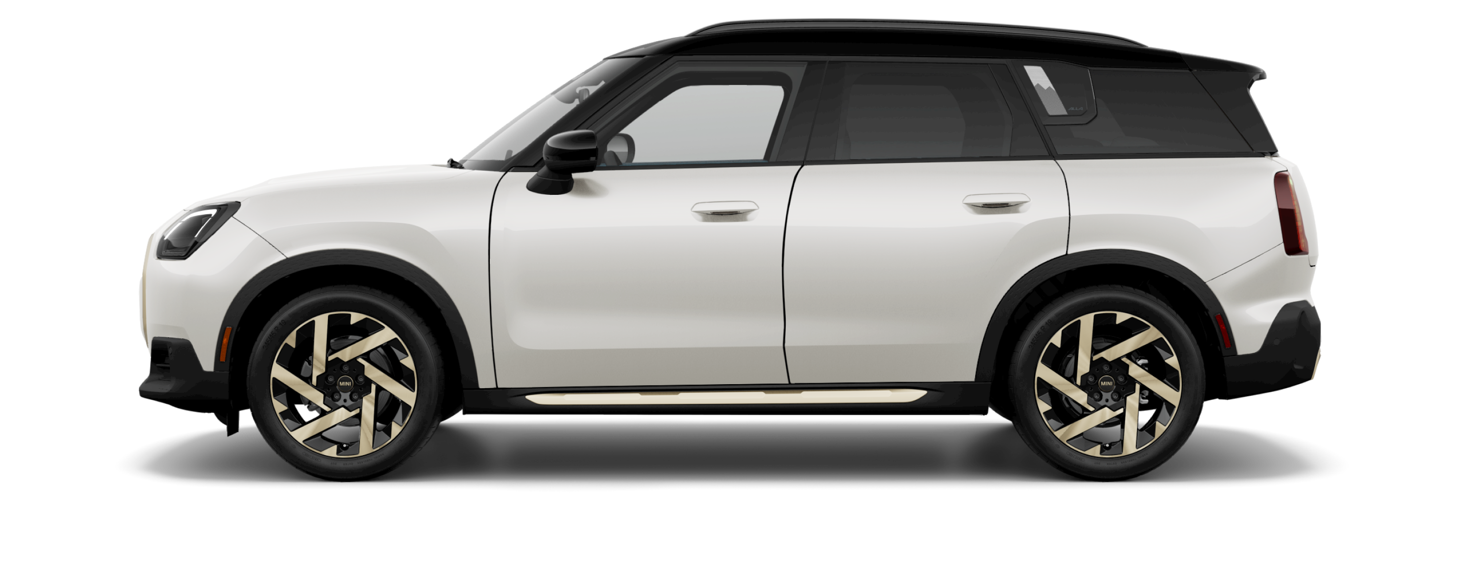 Side view of a 2025 MINI Countryman SE ALL4 in the Nanuq White body color, facing left with its shadow underneath it.
